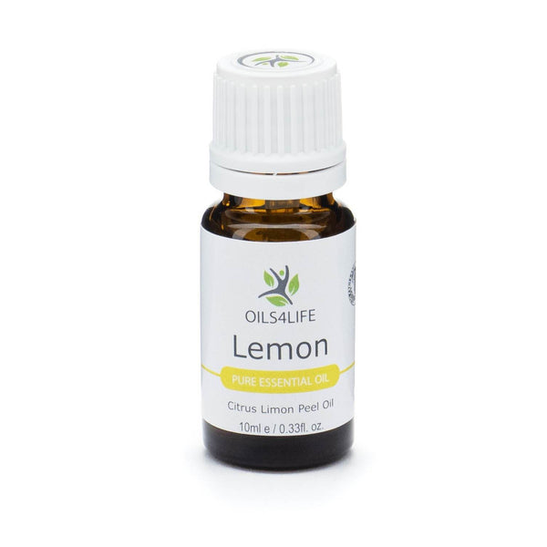 Amber bottle of Lemon Essential Oil beside fresh lemon slices and green leaves on a clean white background
